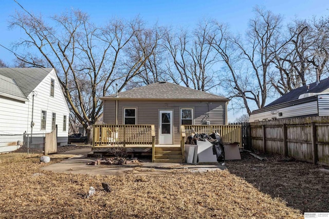 back of house with a wooden deck