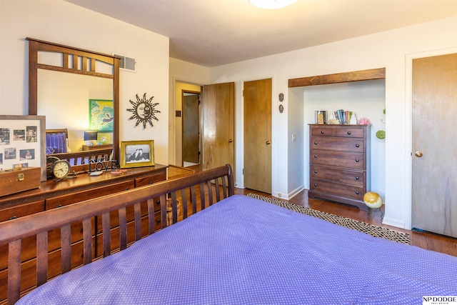 bedroom featuring dark hardwood / wood-style flooring