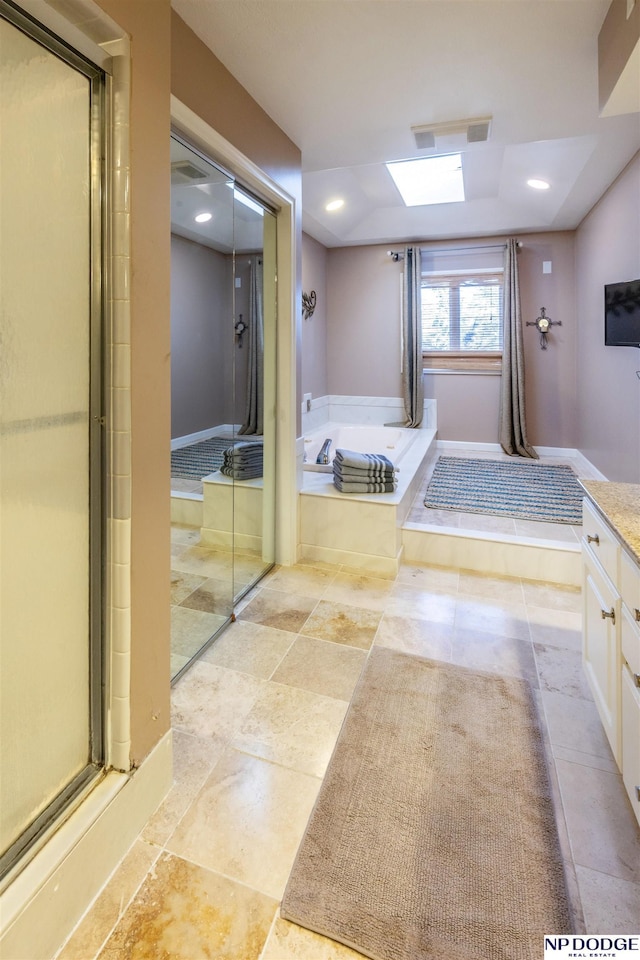 bathroom featuring vanity and separate shower and tub