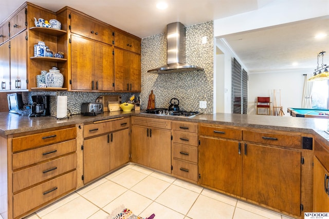 kitchen featuring billiards, wall chimney exhaust hood, decorative backsplash, light tile patterned floors, and stainless steel gas cooktop