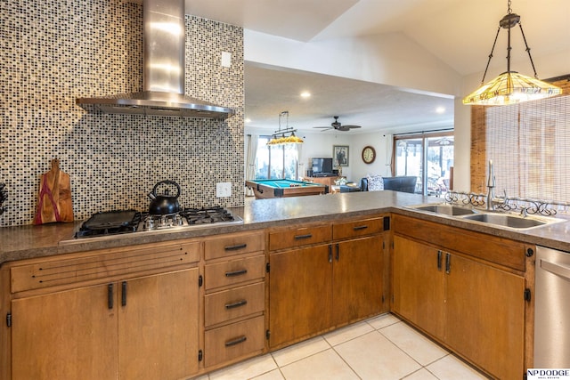 kitchen featuring appliances with stainless steel finishes, backsplash, wall chimney exhaust hood, decorative light fixtures, and pool table