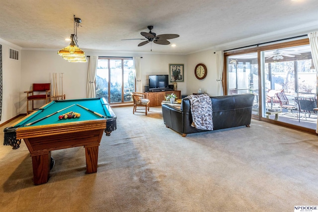 recreation room with ornamental molding, a textured ceiling, billiards, and carpet floors