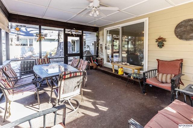 sunroom featuring ceiling fan