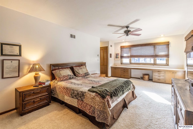 bedroom with ceiling fan and light carpet