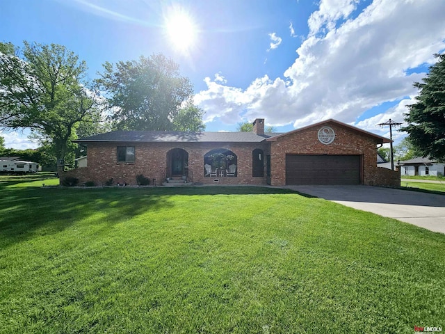 ranch-style home with a front lawn and a garage