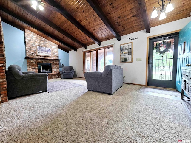 unfurnished living room featuring wooden ceiling, ceiling fan with notable chandelier, a fireplace, beamed ceiling, and light colored carpet