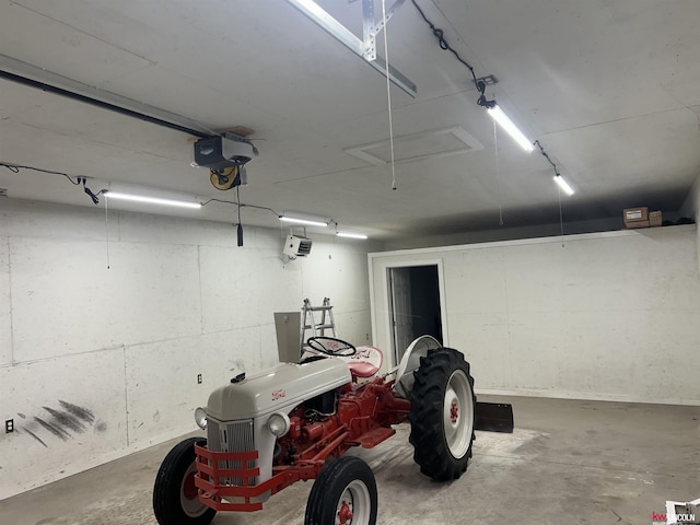 garage featuring a garage door opener