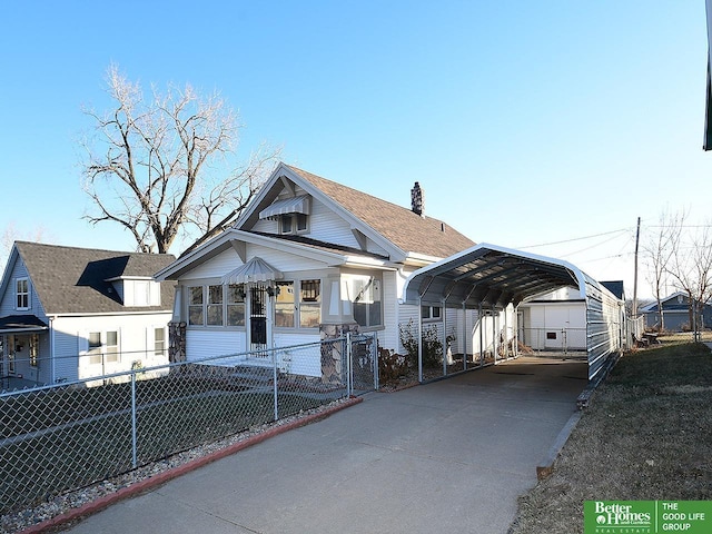 view of front of home featuring a carport