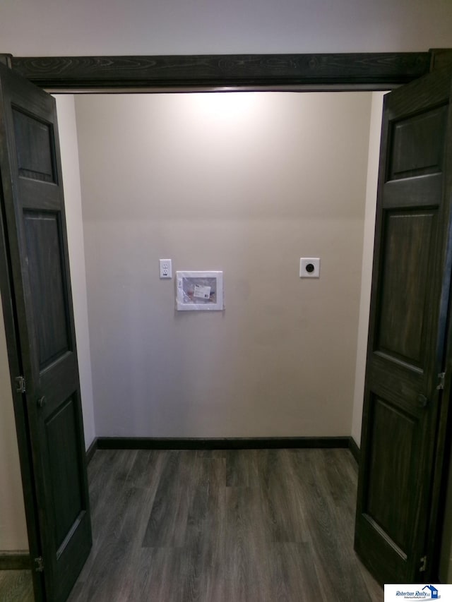 laundry room featuring hookup for an electric dryer, dark hardwood / wood-style floors, and hookup for a washing machine