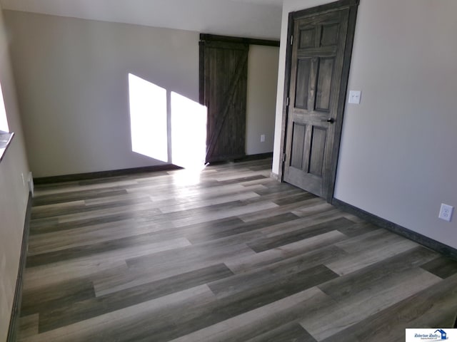 empty room featuring dark hardwood / wood-style flooring