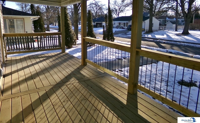 view of snow covered deck