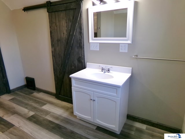 bathroom featuring vanity and wood-type flooring