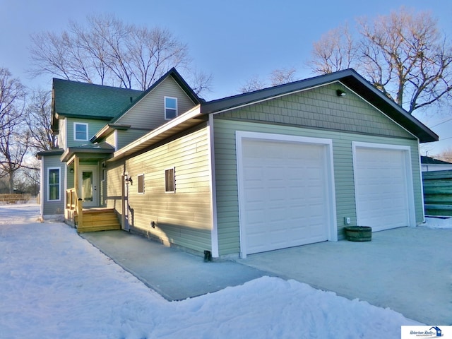 view of side of home with a garage