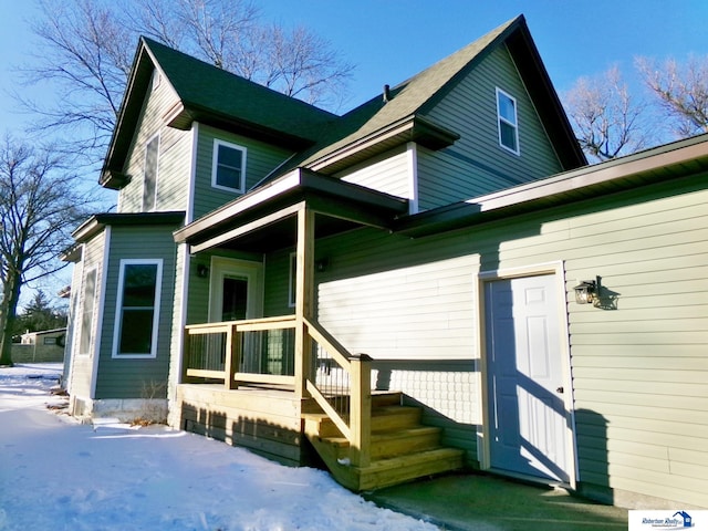 view of snow covered property