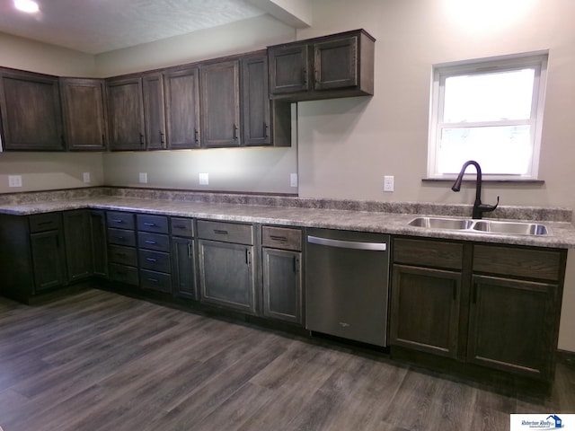 kitchen with dishwasher, dark brown cabinets, dark hardwood / wood-style floors, and sink