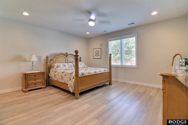 bedroom with ceiling fan and light hardwood / wood-style floors