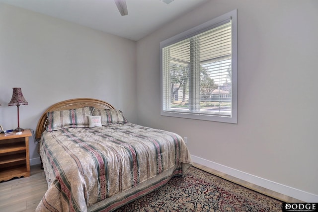 bedroom featuring ceiling fan and light hardwood / wood-style floors