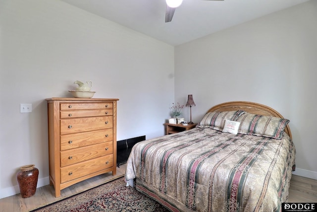 bedroom featuring light hardwood / wood-style flooring and ceiling fan