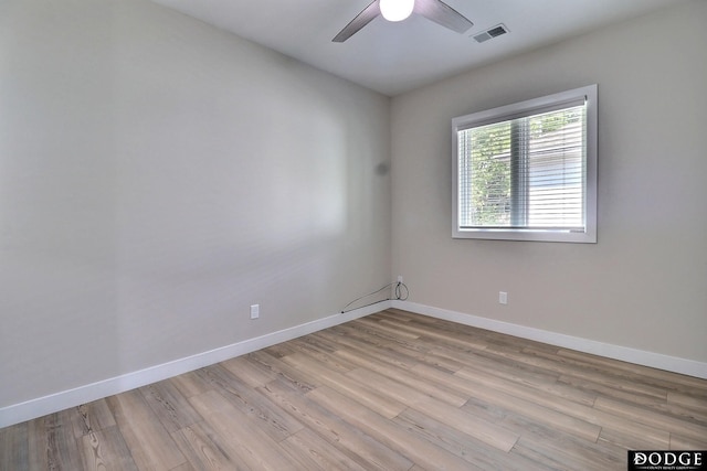 empty room featuring light hardwood / wood-style floors and ceiling fan