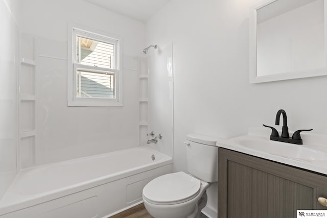 full bathroom featuring shower / tub combination, vanity, and toilet