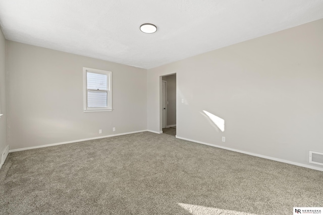 unfurnished room featuring carpet floors