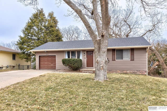 ranch-style home with a front yard and a garage