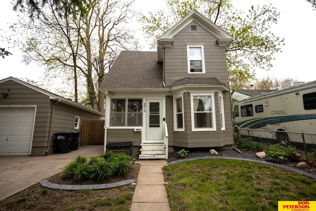 view of front of home featuring a garage and an outdoor structure