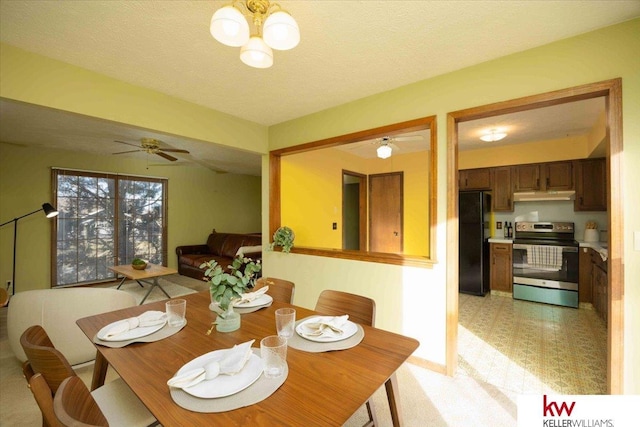 dining area with a textured ceiling