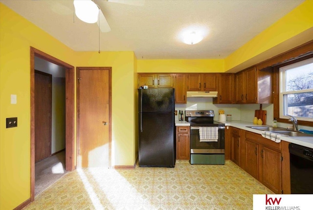 kitchen with ceiling fan, light colored carpet, a textured ceiling, black appliances, and sink