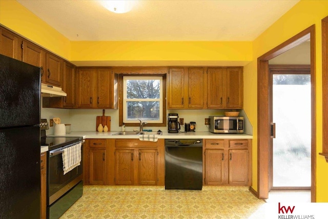 kitchen featuring sink and black appliances