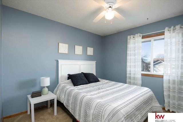 carpeted bedroom featuring ceiling fan