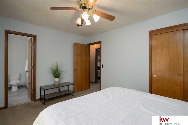 bedroom featuring ceiling fan, light carpet, connected bathroom, and a textured ceiling