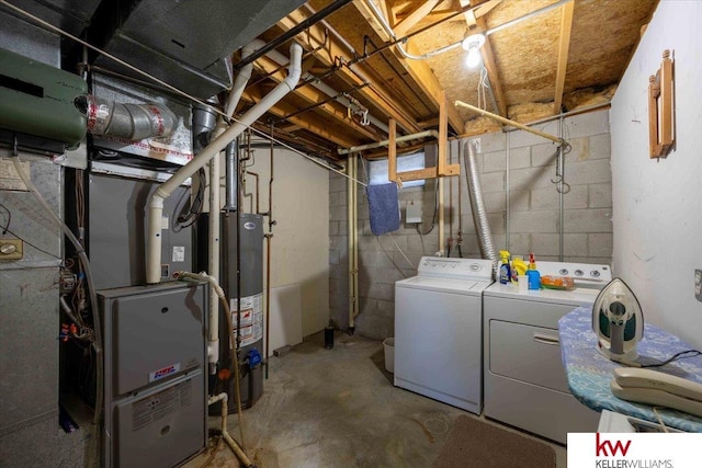 basement with water heater and independent washer and dryer