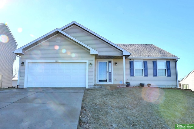 single story home with a front yard and a garage