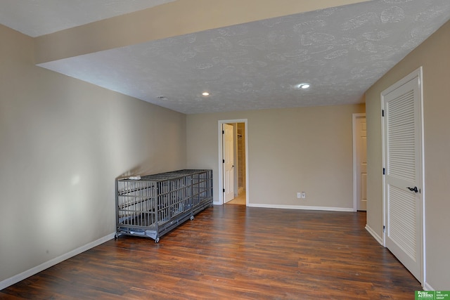 bedroom with dark hardwood / wood-style flooring