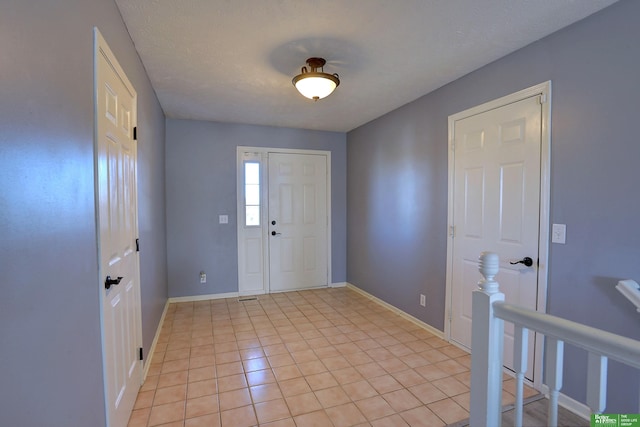 entryway featuring light tile patterned flooring