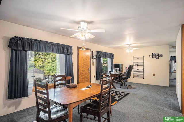 carpeted dining room with ceiling fan