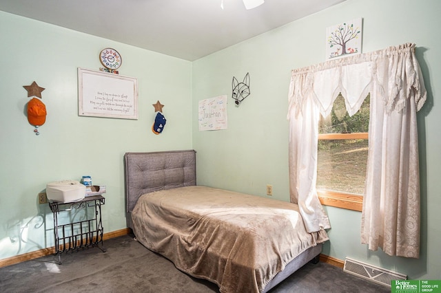 carpeted bedroom with ceiling fan