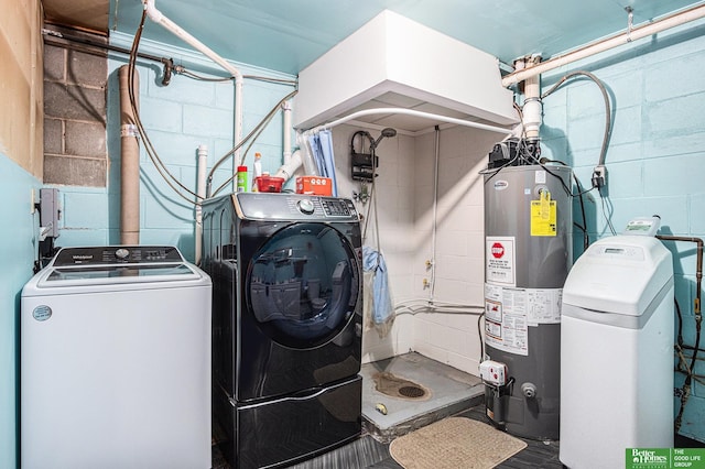 laundry area with water heater and washer and clothes dryer