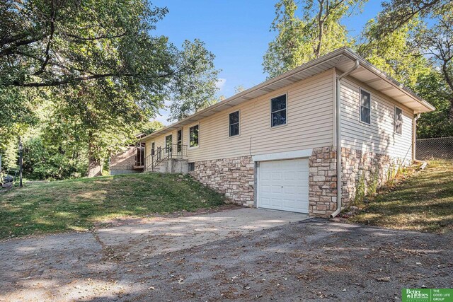 view of side of property featuring a garage