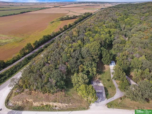 birds eye view of property with a rural view