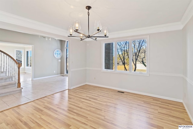 unfurnished dining area featuring a notable chandelier, light hardwood / wood-style flooring, and crown molding