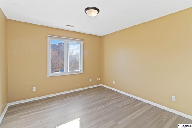 unfurnished room featuring light hardwood / wood-style flooring