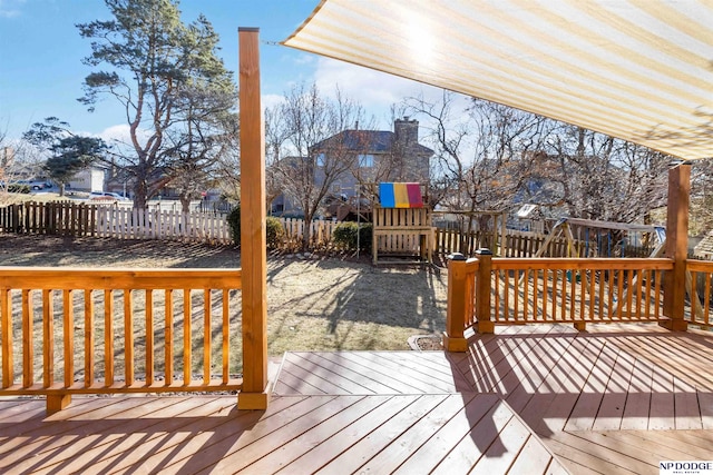 wooden terrace with a playground