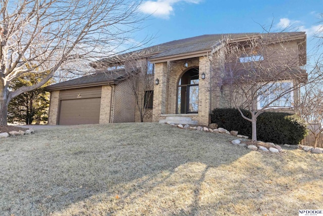 view of front facade with a front yard and a garage