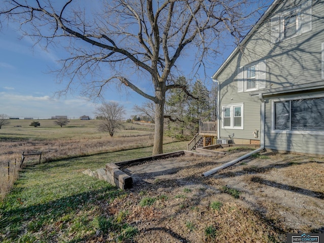 view of yard with a rural view