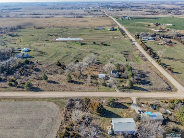 birds eye view of property with a rural view