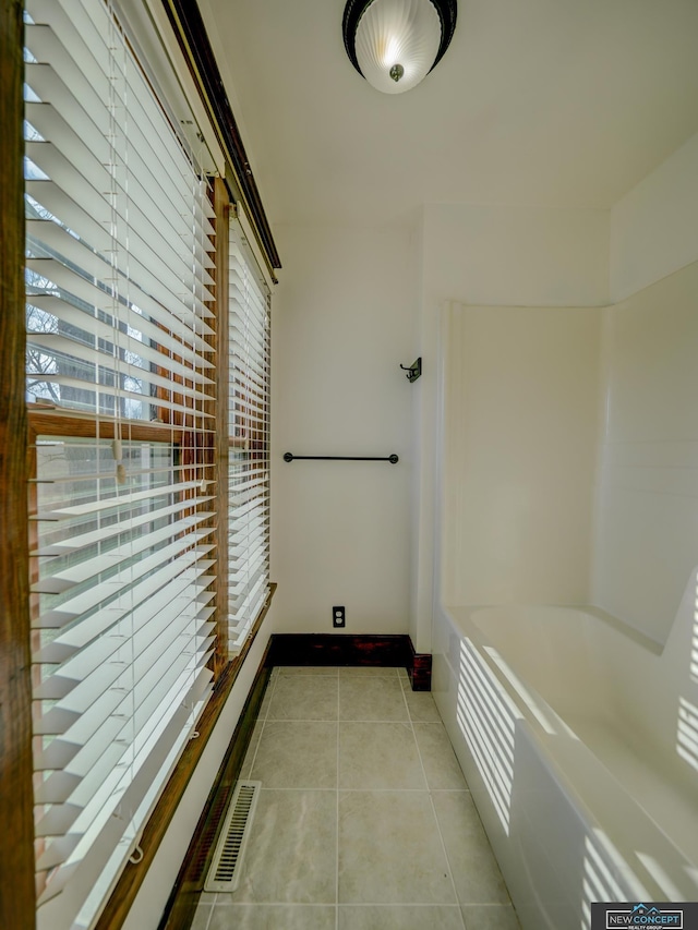 bathroom with tile patterned floors