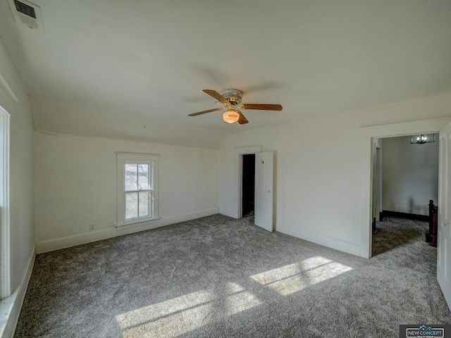 unfurnished room featuring ceiling fan, vaulted ceiling, and light colored carpet