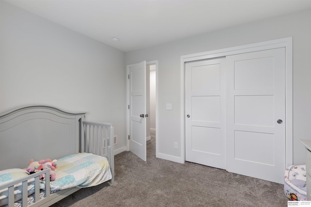 carpeted bedroom featuring a closet